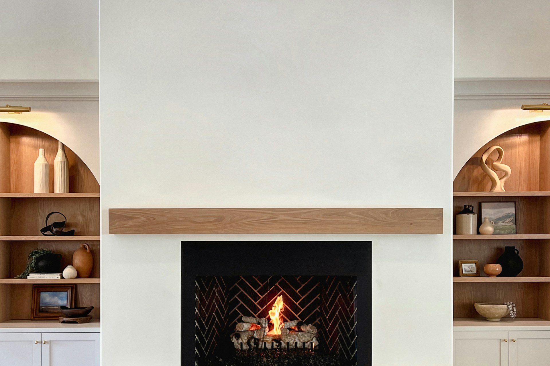 Oak mantel beam above a fireplace